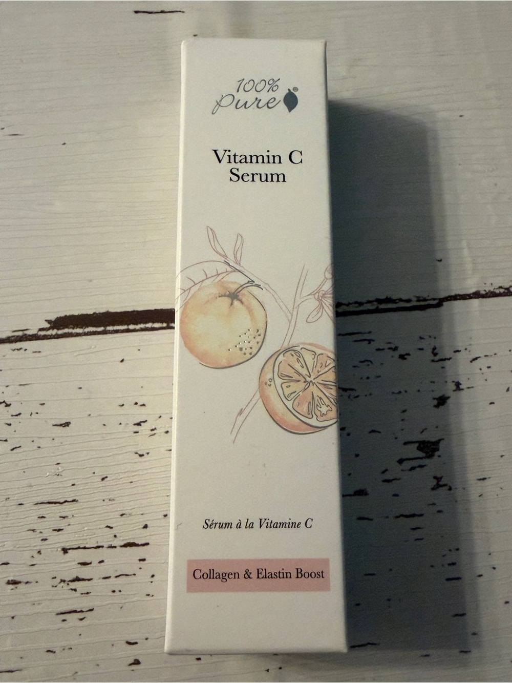 100% Pure Vitamin C Serum in cream and peach hues